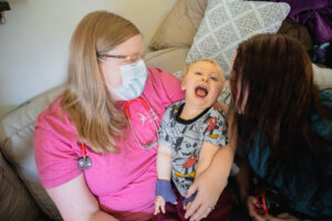 Happy Cardinal Kids Patient with Cardinal Kids Nurse Practitioner